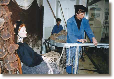 p�cheur ramandant les filets